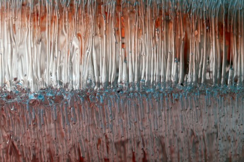 Image water droplets on brown wooden surface
