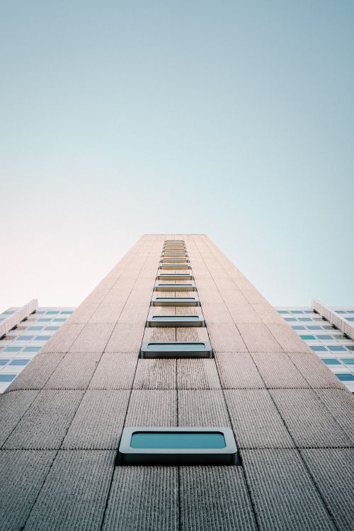 gray concrete building under blue sky during daytime