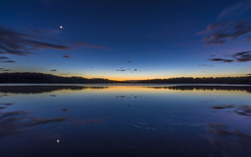 Image body of water under blue sky during daytime