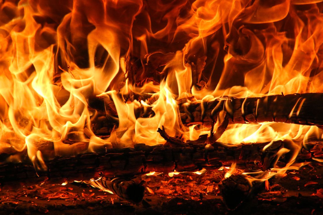 Burning Wood on Brown Soil. Wallpaper in 5395x3597 Resolution