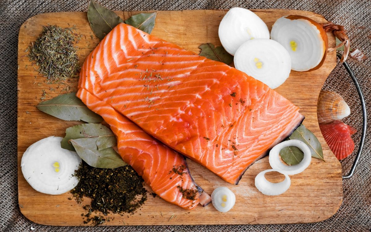 sliced fish meat on chopping board