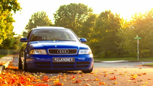 Image blue audi a 4 on road during daytime