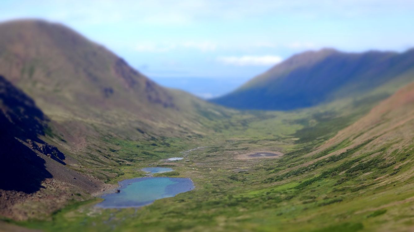 Green Mountains Near Lake Under White Clouds During Daytime. Wallpaper in 4896x2752 Resolution