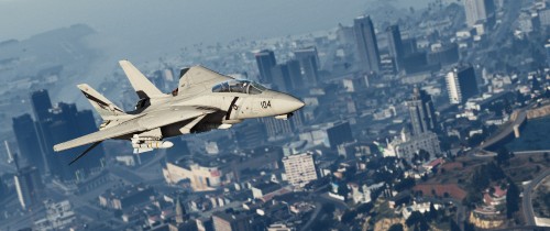 Image white and gray jet plane flying over city buildings during daytime