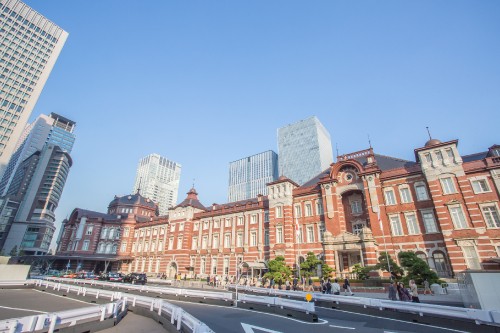 Image cars on road near buildings during daytime