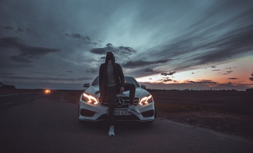 Image white car on road during sunset