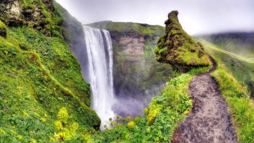 Image waterfalls on green moss covered mountain