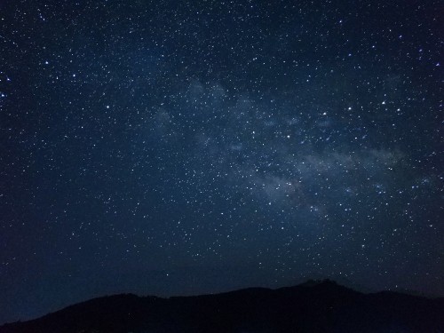 Image silhouette of mountain under starry night