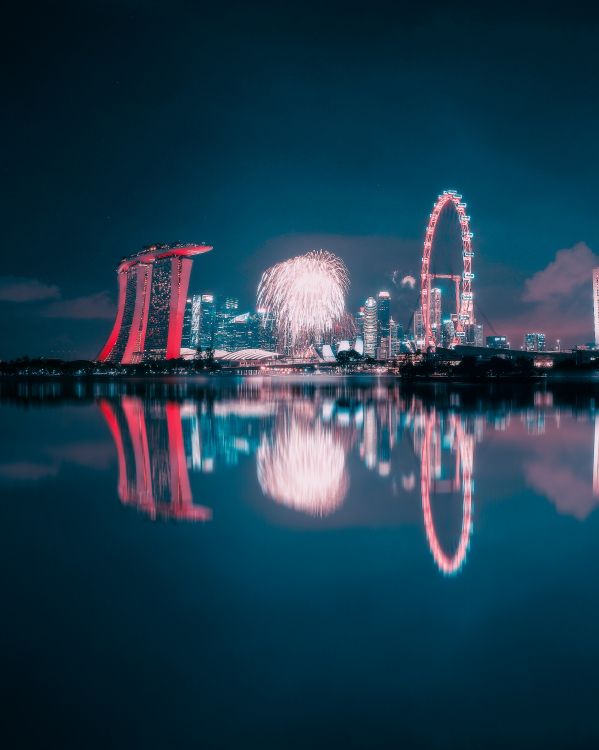 Feuerwerk Über Dem Gewässer Während Der Nacht. Wallpaper in 3681x4602 Resolution