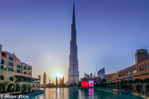 Image city buildings near body of water during daytime