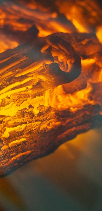 Image brown wood with fire in close up photography