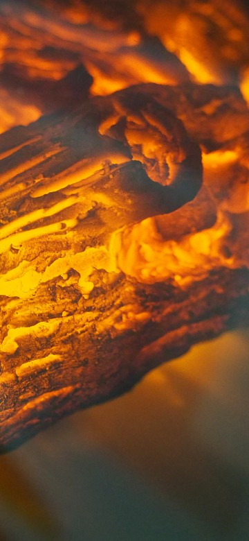 Image brown wood with fire in close up photography