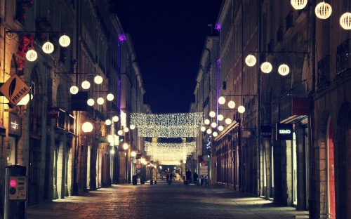 Image people walking on street during night time