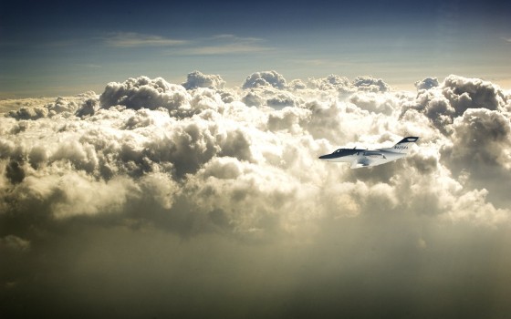 Wallpaper White and Black Airplane Flying Over White Clouds During ...