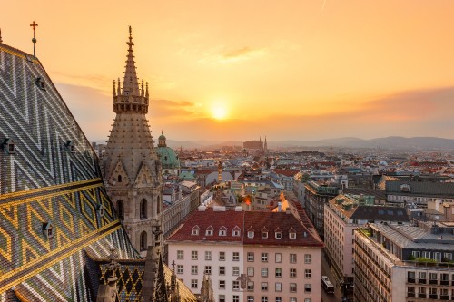 Image aerial view of city buildings during sunset