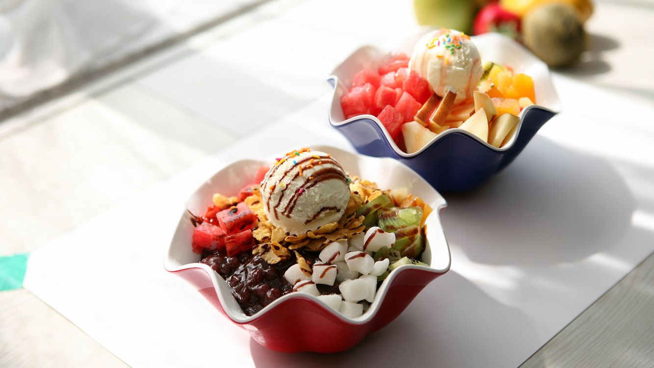 red and white ceramic bowl with ice cream