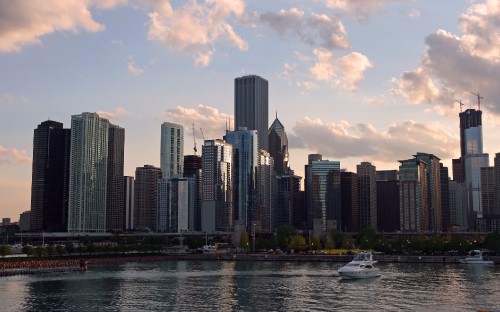 Image white boat on water near city buildings during daytime