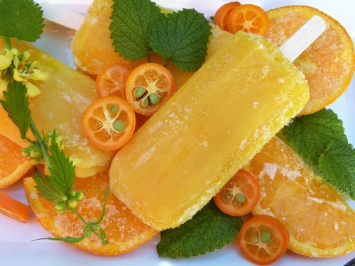 Image sliced orange fruit on white ceramic plate