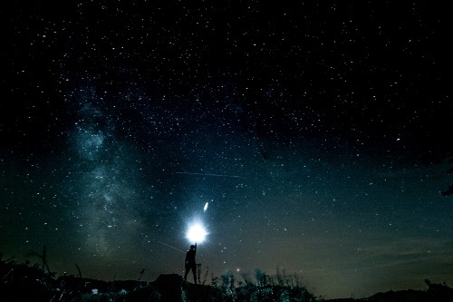 Image people standing under starry night