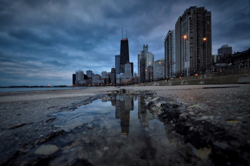 Image city skyline across the sea during daytime