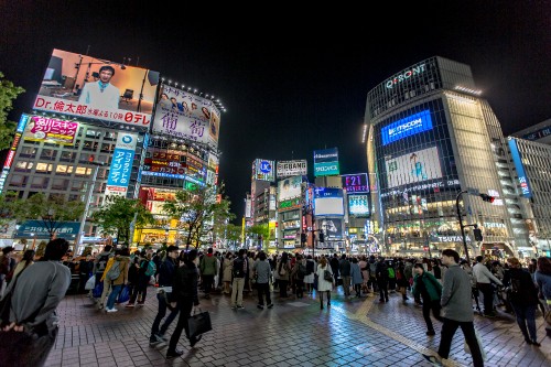 Image people walking on street during nighttime