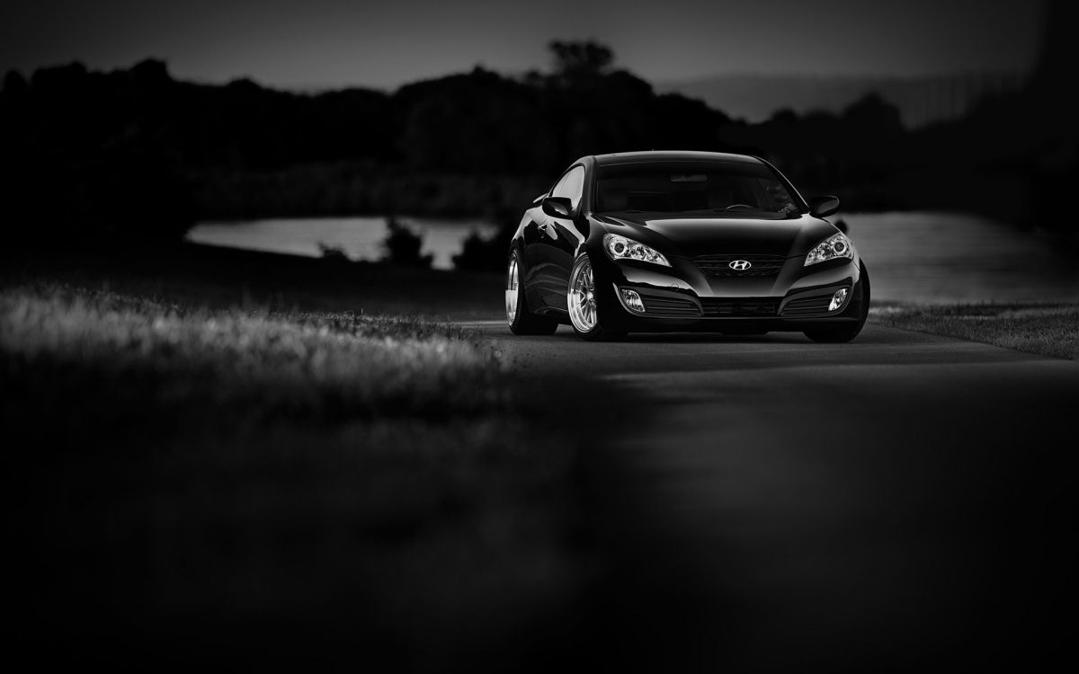 grayscale photo of car on road