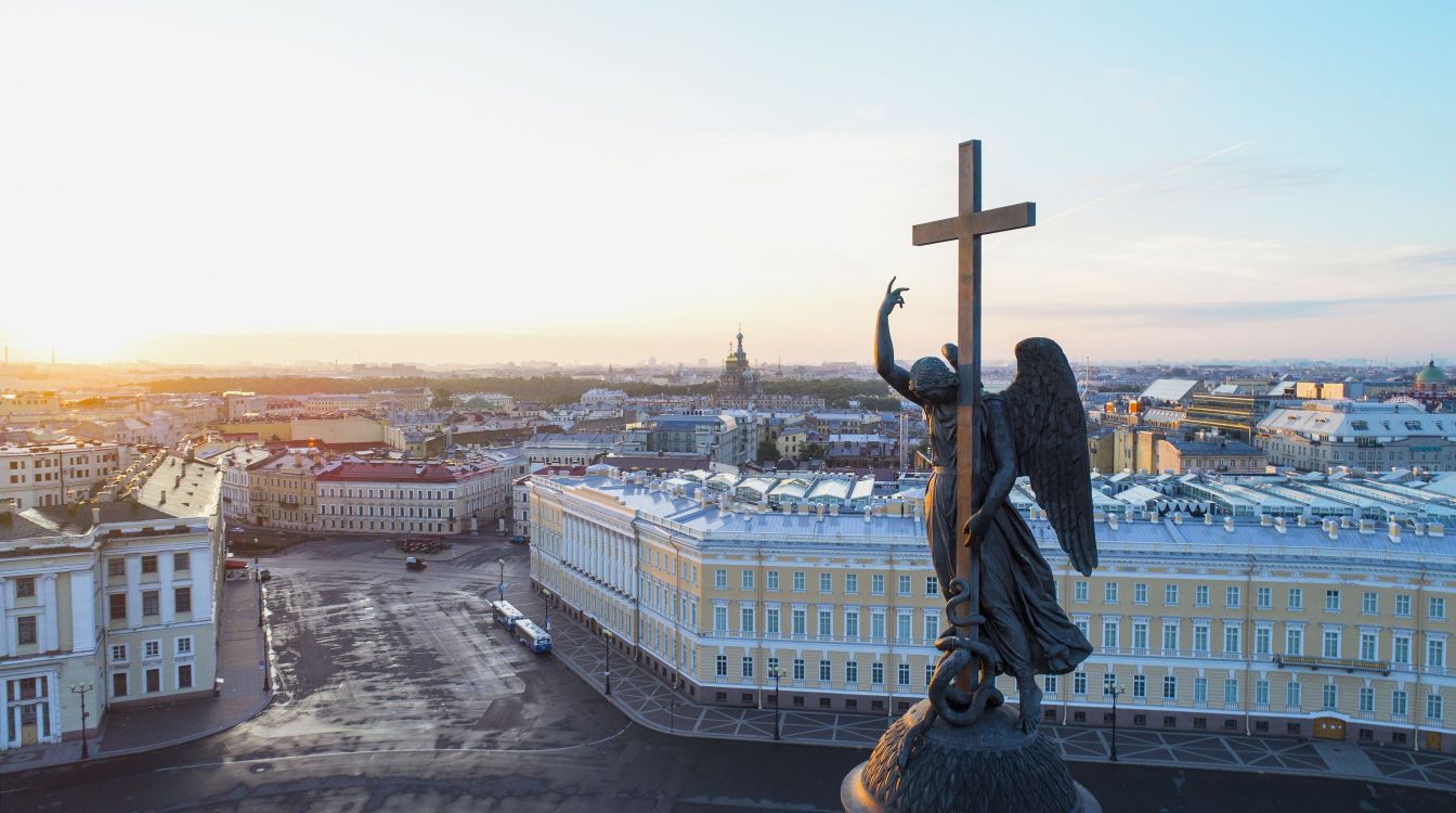 brown wooden cross on top of building during daytime