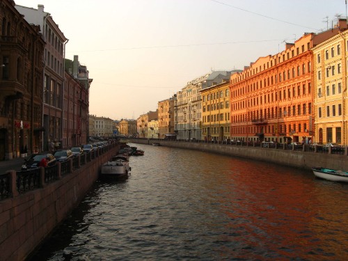 Image river between buildings during daytime