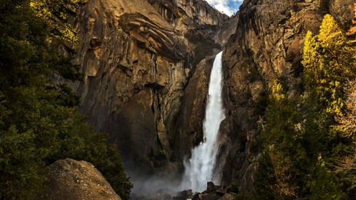 Image waterfalls in brown rocky mountain during daytime