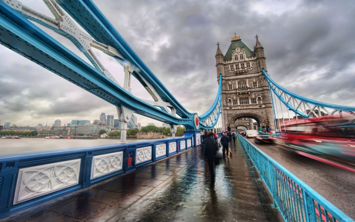 people walking on bridge during daytime