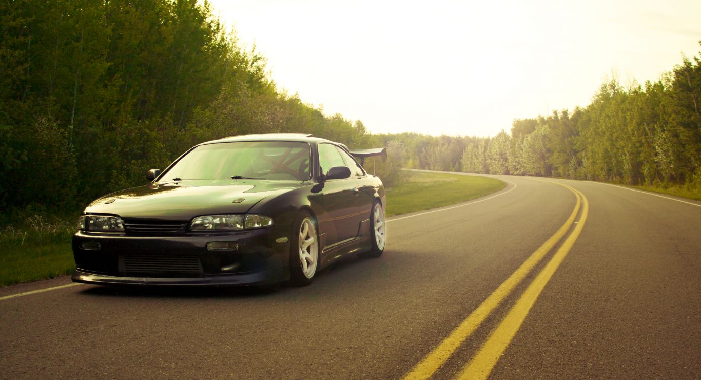 white bmw m 3 on road during daytime