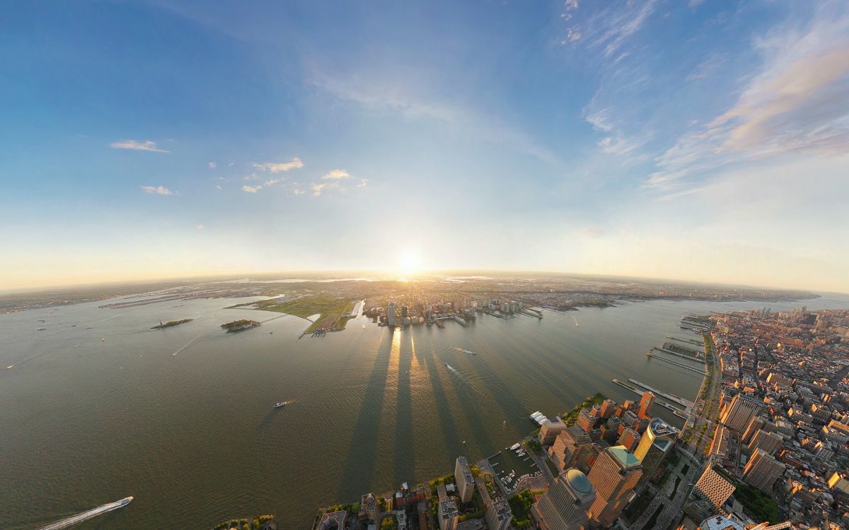 city buildings near body of water during daytime