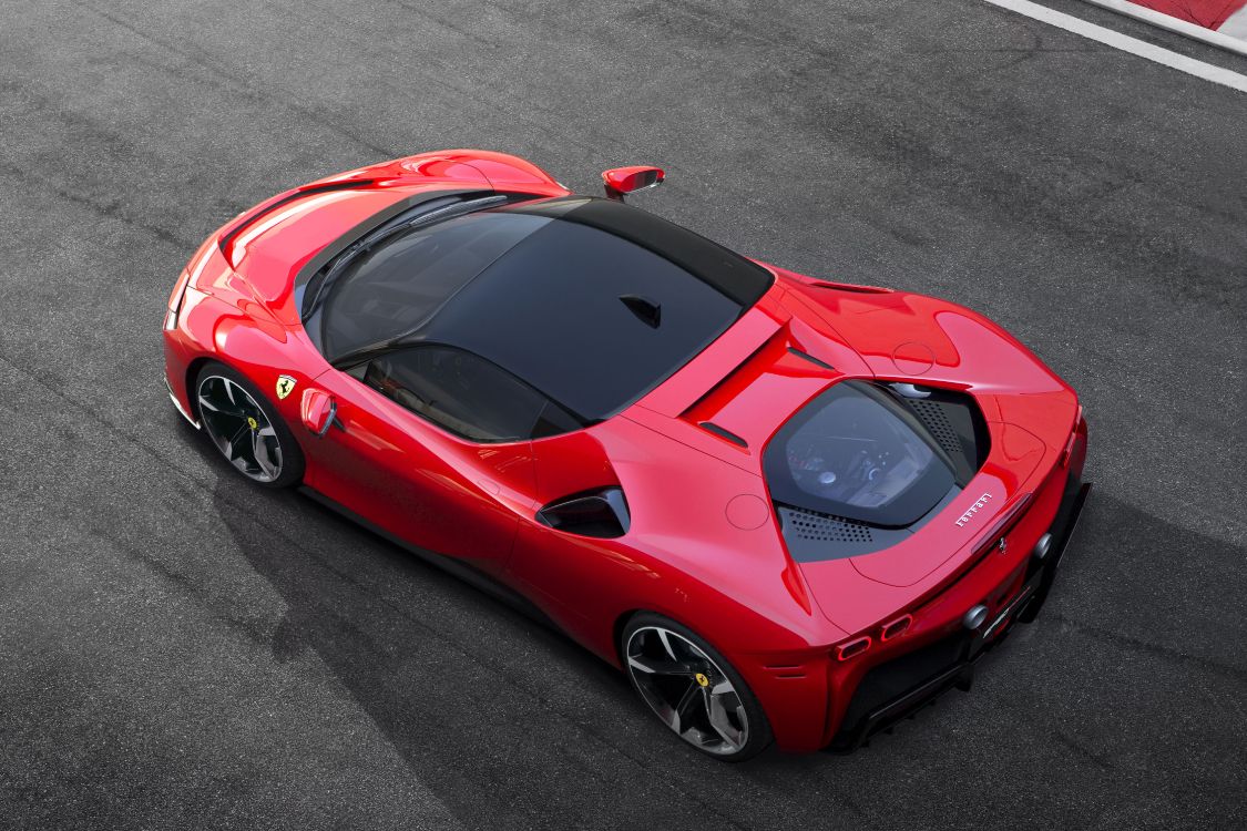 red ferrari 458 italia on road