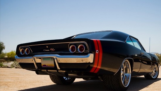 Image black chevrolet camaro on road during daytime