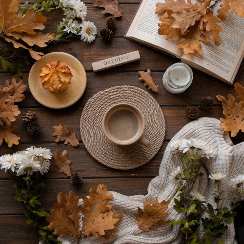 Image brown dried leaves on brown wooden table