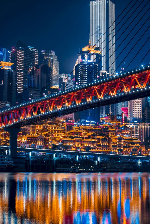 Image lighted bridge over water during night time