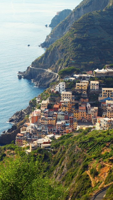 Image aerial view of city near body of water during daytime