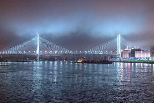 Image bridge over body of water during night time