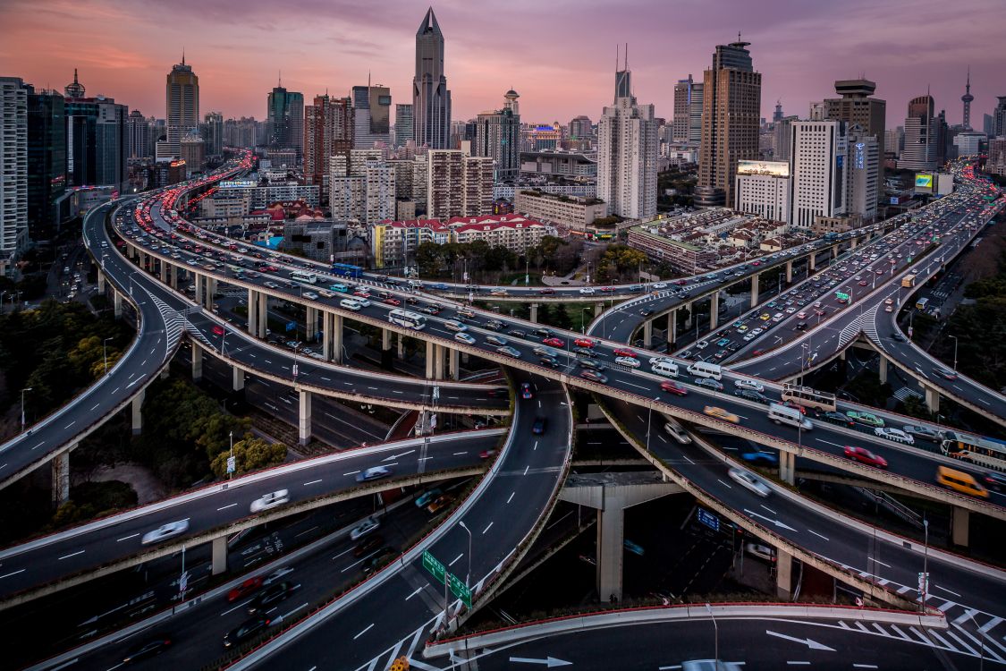 city buildings and road during daytime