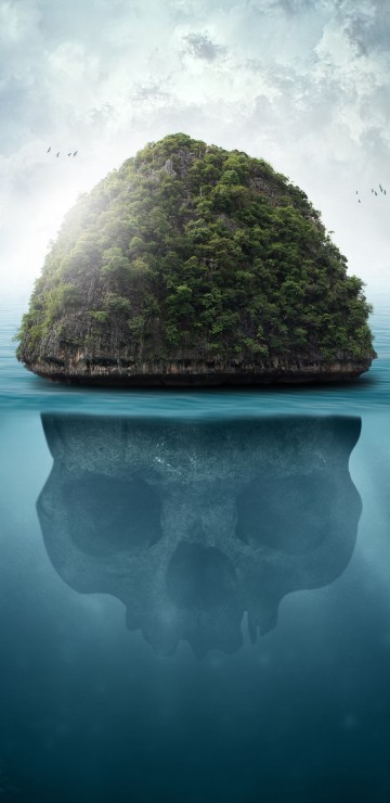 Image brown rock formation on body of water under white clouds and blue sky during daytime