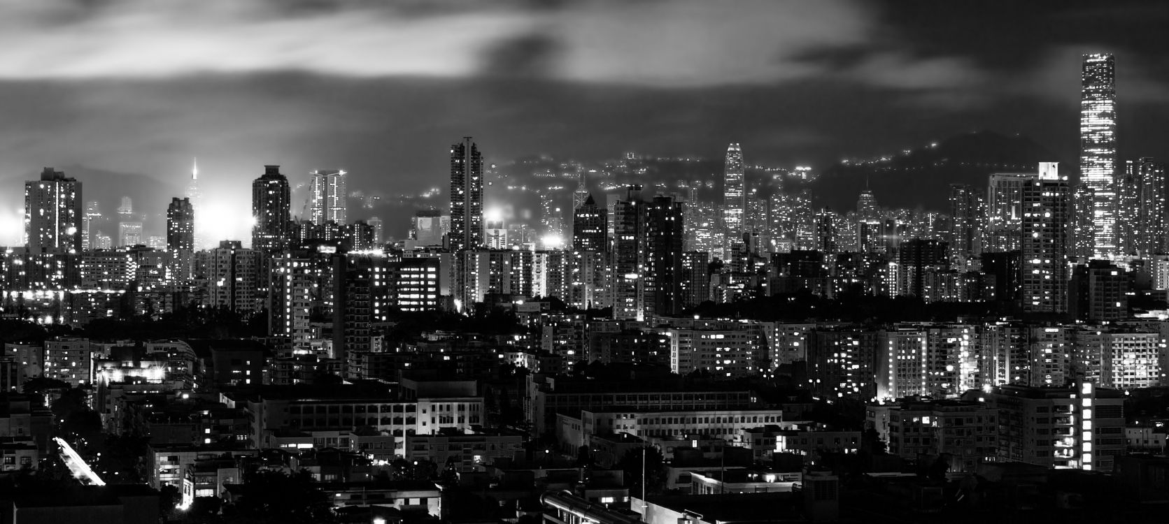 grayscale photo of city buildings