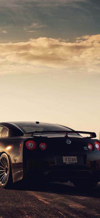 Porsche 911 Noire Sur Fond Gris. Wallpaper in 1125x2436 Resolution