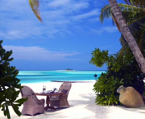 Image brown wooden outdoor lounge chairs on beach during daytime