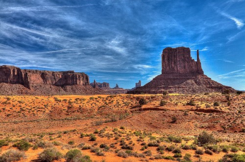 Image brown rock formation under blue sky and white clouds during daytime