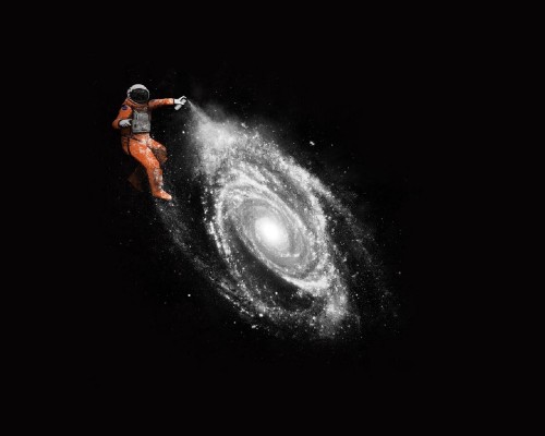 Image man in orange jacket and black pants standing on black and white galaxy