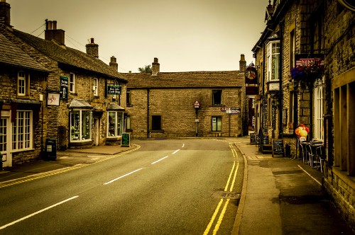 Image brown brick building beside road