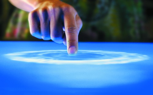 Image persons hand on blue textile