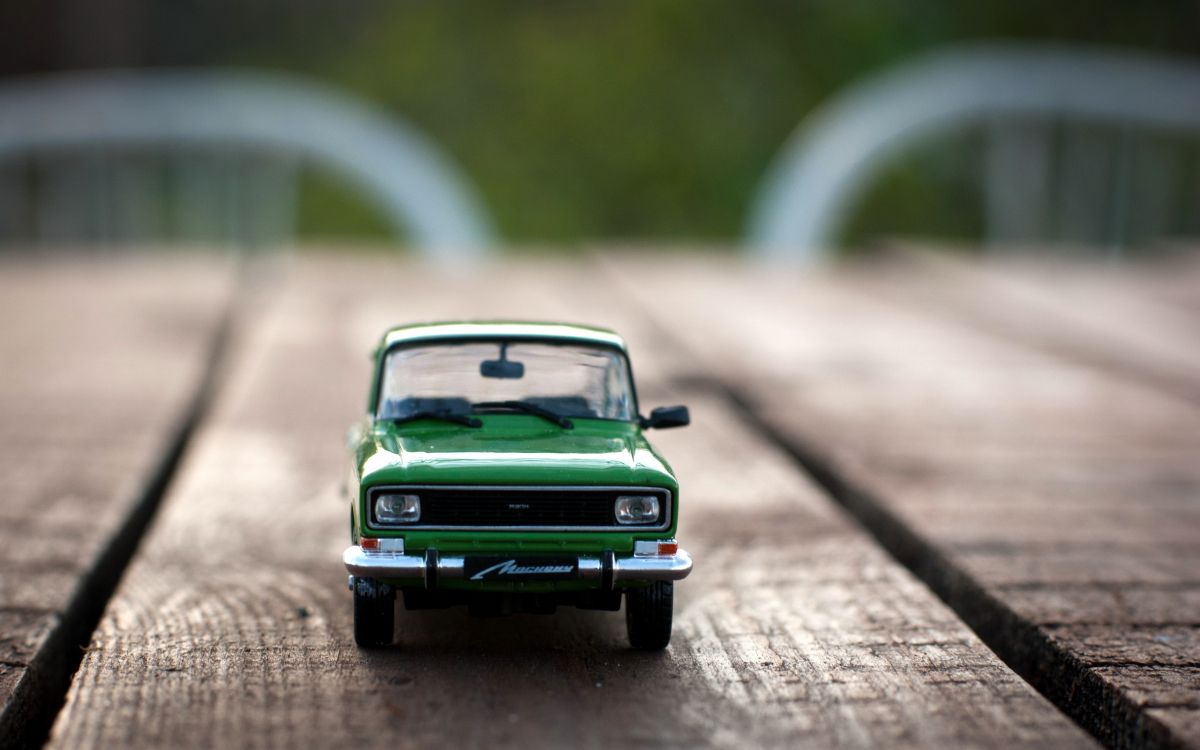 green car scale model on road