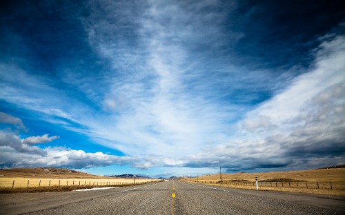 Image gray concrete road under blue sky