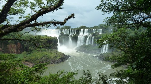 Image waterfalls under white cloudy sky during daytime